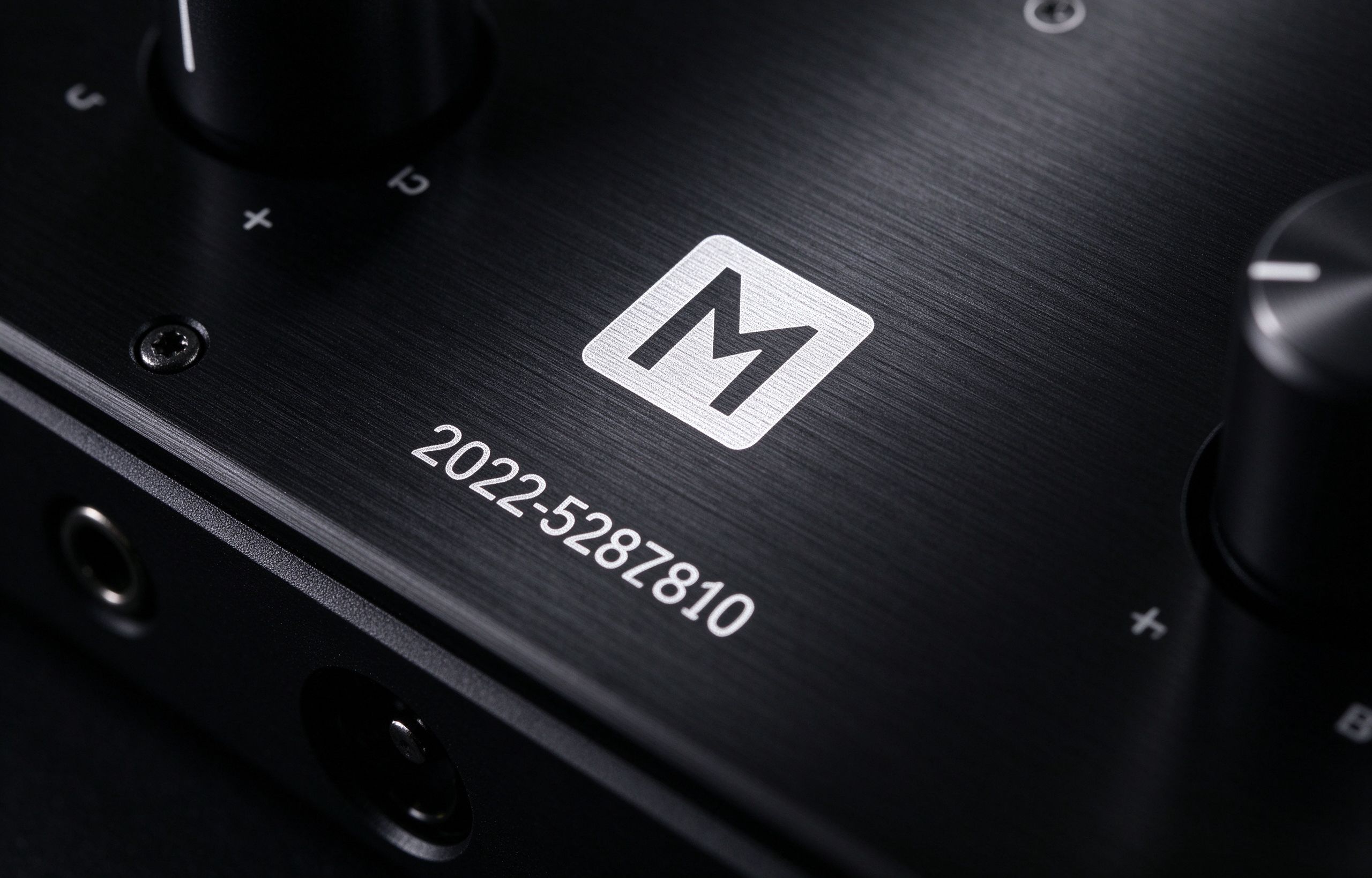 Laser engraved logo and serial number on black anodized panel