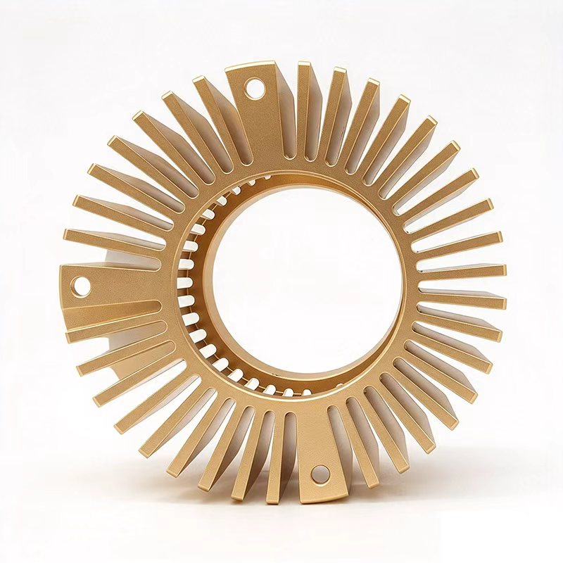 Round aluminum heat sink with drilled mounting holes on mounting ears